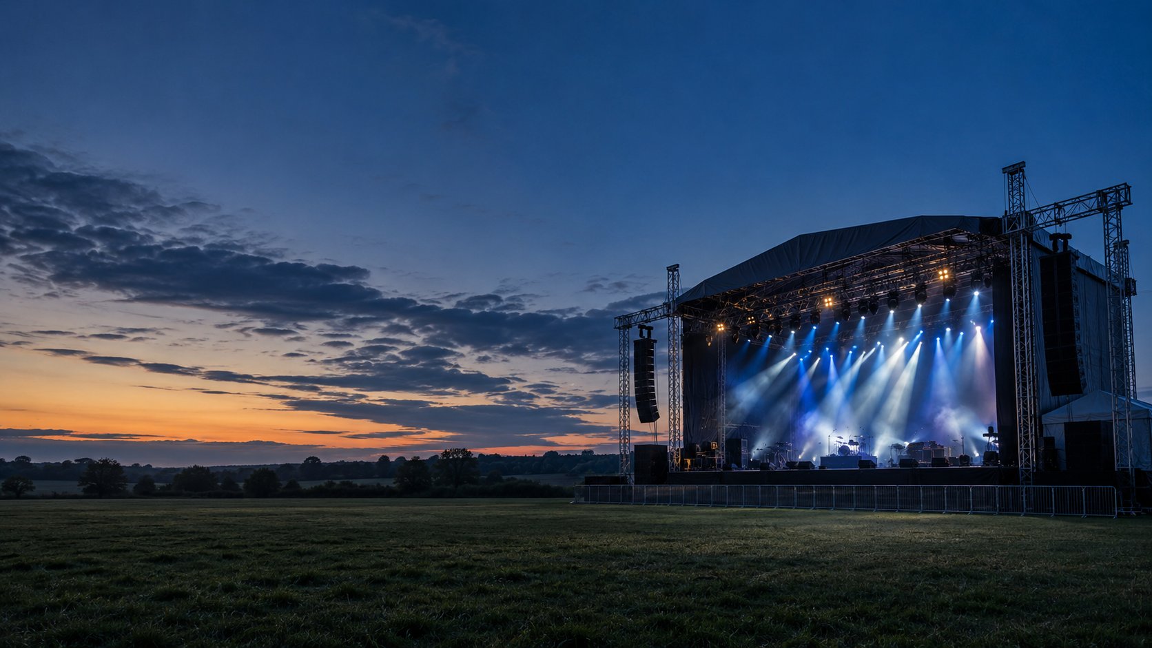 Illustrative outdoor stage illuminated at dusk